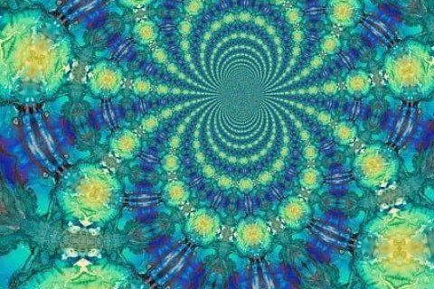 Zu sehen ist ein Batikmuster in den Farben blau, gr&uuml;n und gelb
